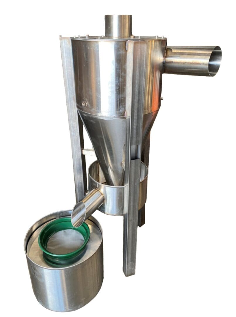 A stainless steel machine with a green handle.