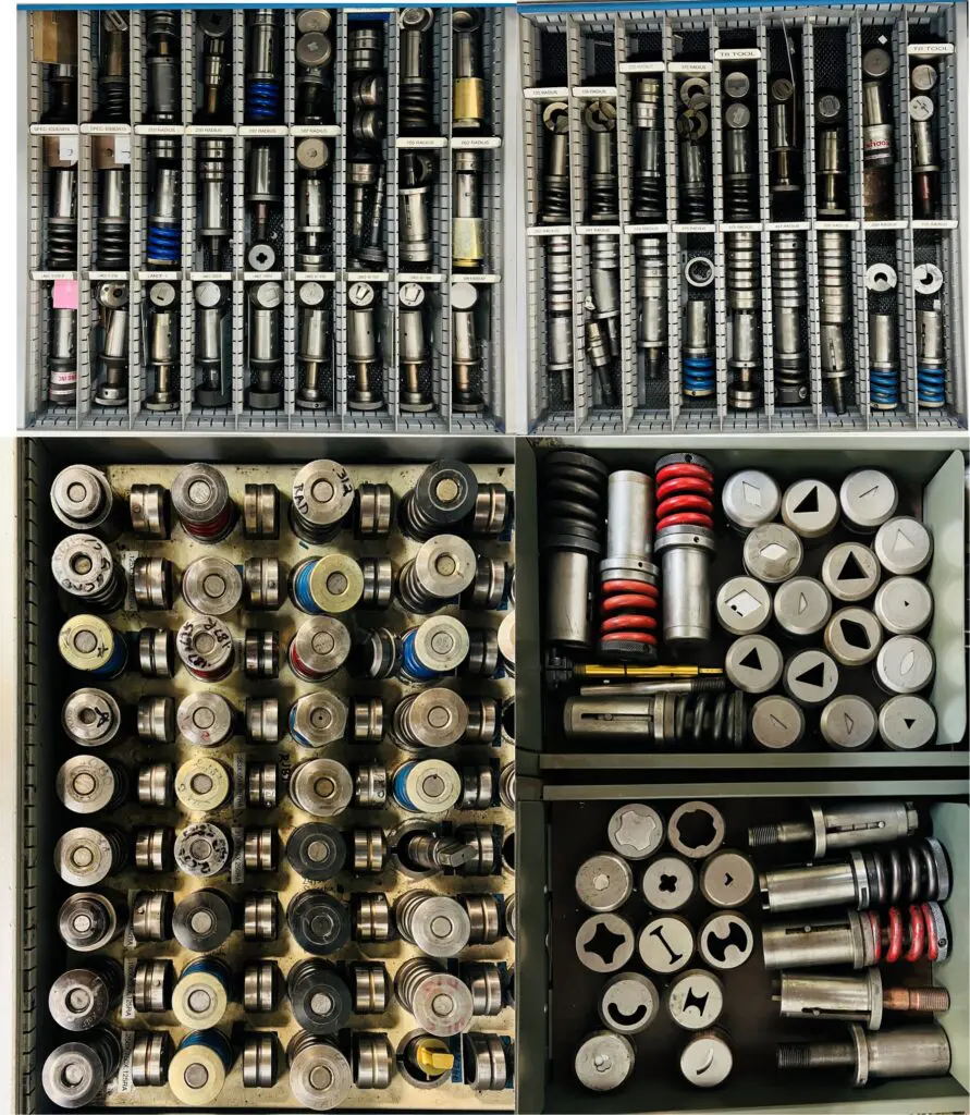 A collection of batteries and plugs in different compartments.