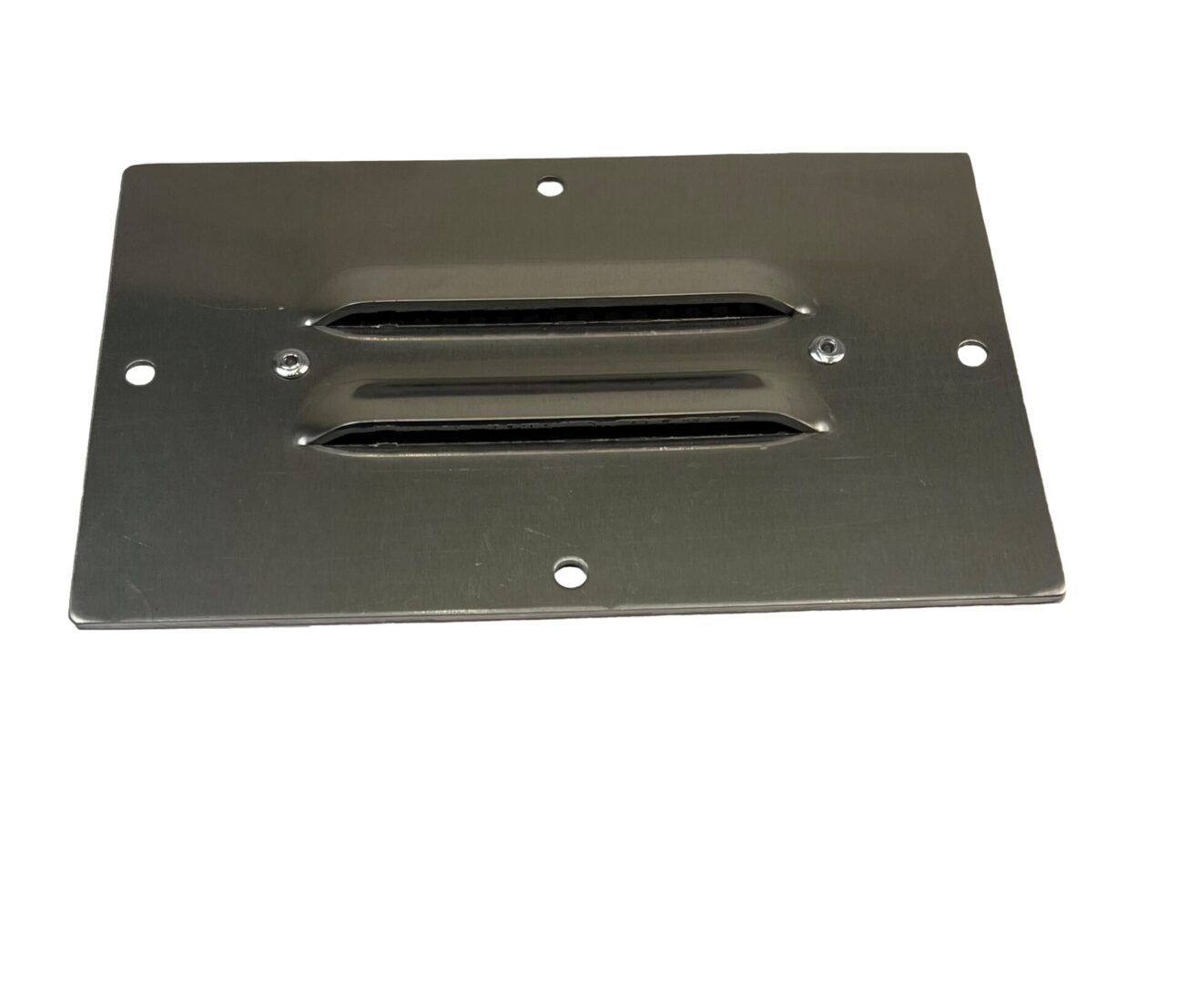 A metal plate with two vents on it.